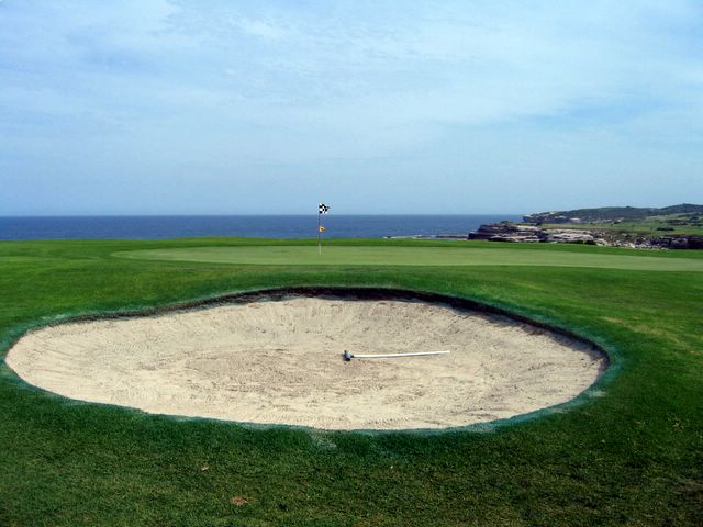 Coast Golf Course - Little Bay: Green on Hole 15 with large bunker
