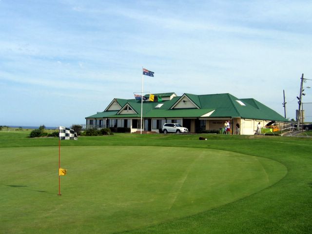 Coast Golf Course - Little Bay: Green on Hole 18 with Club House in the background