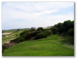 Coast Golf Course - Little Bay: The fairway lies beyond the immediate shrub.