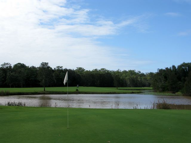 Gainsborough Greens Golf Course - Pimpama: Green on Hole 18.  If you are brave you can try to clear the water or alternatively go around it.