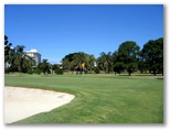 Surfer's Paradise Golf Club - Gold Coast: Green on Hole 14 with course Resort in the background