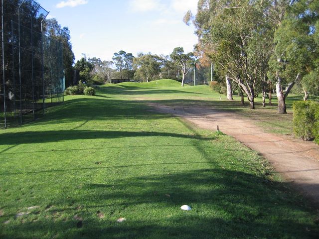 Gordon Golf Course - Gordon Sydney: Fairway view Hole 4 - note high mounds behind green