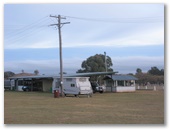 Gulgong Showground Caravan Park - Gulgong: Powered sites for caravans with facilities for campers in the background