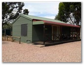 Laura Community Caravan Park - Laura: Family cabin which will sleep up to seven people, with two separate bedrooms. One bedroom has a double bedand the other has a single set of bunks. Another bedroom has a double single combination.