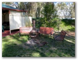 Narrandera Caravan Park - Narrandera: Outdoor fireplace adjacent to Camp Kitchen