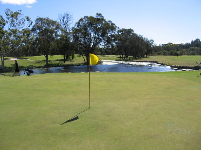 Redland Bay Golf Course - Redland Bay: Green on Hole 7 with water trap protecting the approach to the green