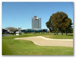 Royal Pines Golf Course - Benowa: Bunker on Hole 9 with view of Resort
