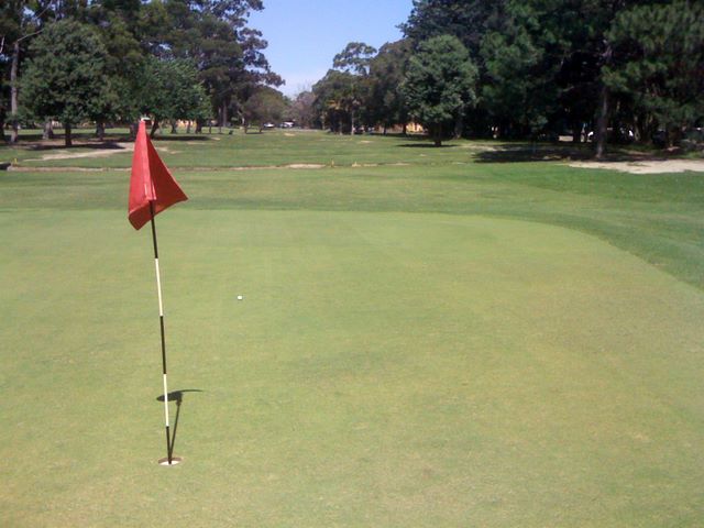 Urunga Golf and Sports Club - Urunga: Green on Hole 3 looking back along the fairway.