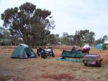 Ayers Rock Campground - Yulara: Another view of our campsite with views of more campers opposite. Plenty of camp sites available - next time we will get a powered site.