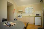 Captain Cook Holiday Village - Seventeen Seventy: Kitchen and Dining Room in 2 bedroom villas