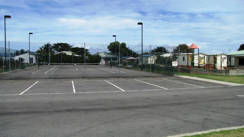 Hopkins River Caravan Park - Warrnambool: Tennis court and playground for children on the right.