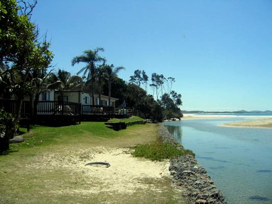 Arrawarra Beach Holiday Park - Arrawarra: Cottages with views of the sea and creek.
