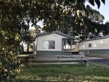 Bega Caravan Park - Bega: Modern spacious cottages available for families, as singles or groups. These cottages are equipped with everything you need including a very large television set.