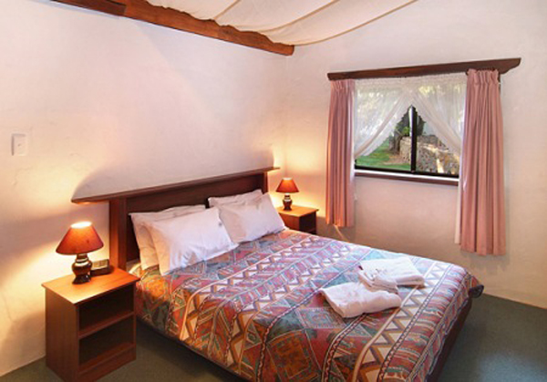 Sandy Bay Holiday Park - Busselton: Main bedroom in Swiss Style Chalet