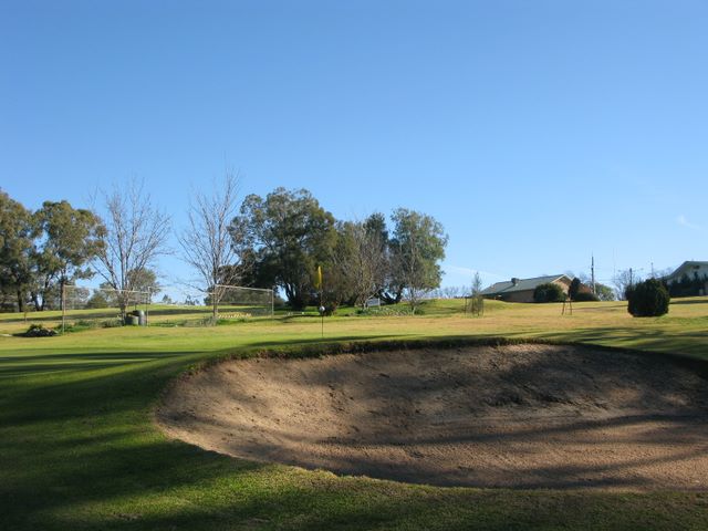 Cowra Golf Club - Cowra: Green on Hole 2 with large sand trap.