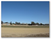 Cowra Showground Caravan Park - Cowra: Distance view of the grandstand from the ring.