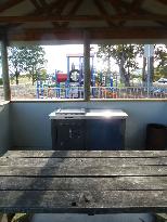 Dover Beachside Tourist Park - Dover: Interior of camp kitchen looking towards playground