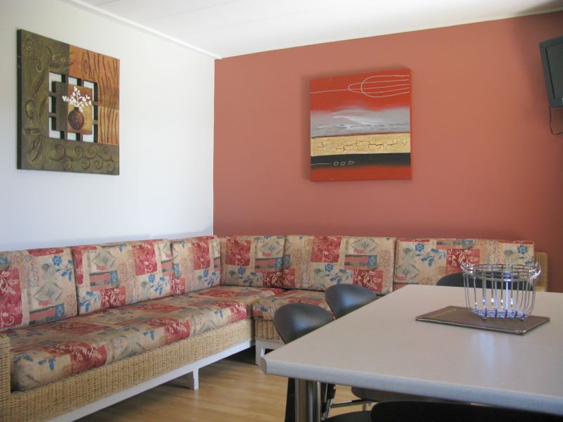 Wollongong Surf Leisure Resort - Fairy Meadow: Lounge room and dining area in one bedroom terrace apartment.