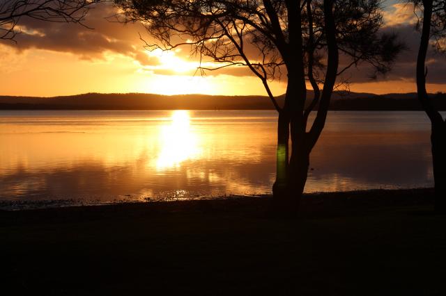 Lakeside Resort Forster - Forster: Sunset over Pipers Bay from waterfront caravan site.