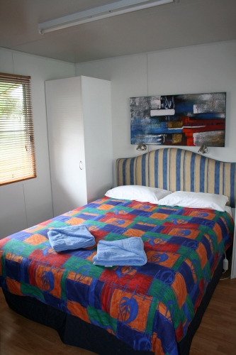 Sapphire City Caravan Park - Inverell: Interior of cabin showing main bedroom