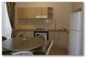 Discovery Holiday Parks - Jindabyne - Jindabyne: Kitchen and dining area in Deluxe 4.5 Star Family Villa.