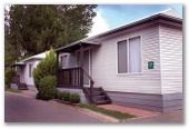 Discovery Holiday Parks - Jindabyne - Jindabyne: Kosciuszko-Townsend 4 Star. Superior 4 Star Family Spa Villa. 2 bedroom Cabin with Double bed in one room and bunks in the other. Sleeps 6.