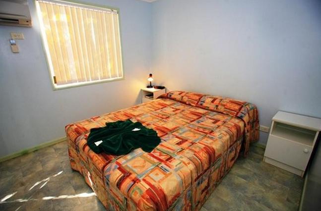 Pilbara Holiday Park - Karratha: Interior of cabin showing main bedroom.
