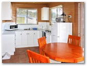 Charlie's Place Caravan Park - Lower Mangrove: Cottage kitchen dining room