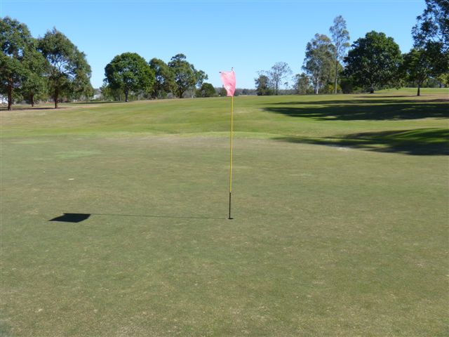 Lowood and District Golf Club - Lowood: Green on Hole 9 looking back along the fairway.