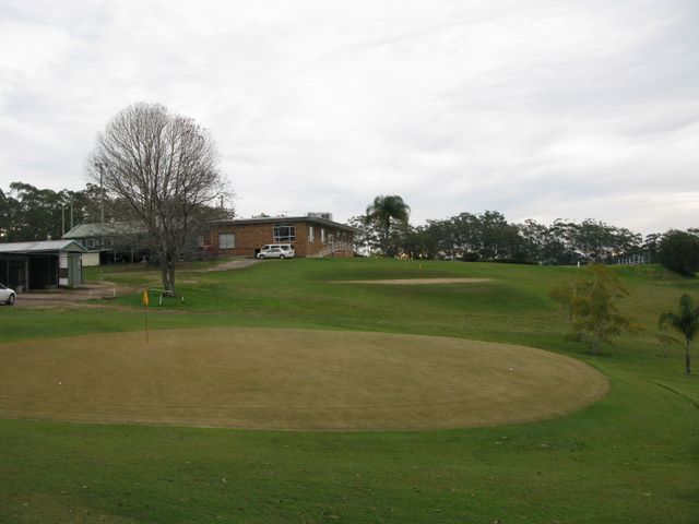 Macksville Country Club - Macksville: Green on Hole 9 with club in the background
