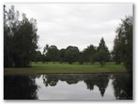 Macksville Country Club - Macksville: Looking across the water hazzard to the green.