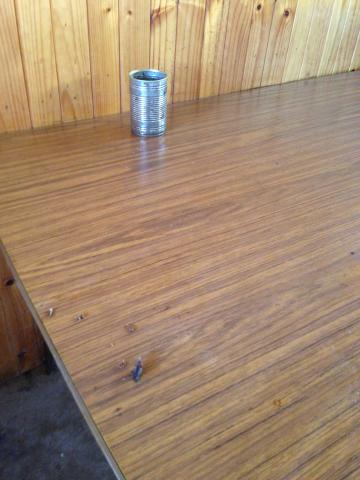 River Road Caravan Park - Mildura: Kitchen table with ashtray