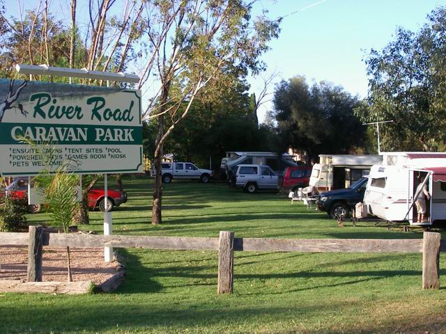 River Road Caravan Park - Mildura: River Road Caravan Park welcome sign with powered sites in the background.