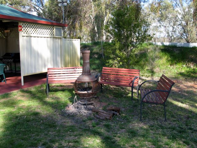 Narrandera Caravan Park - Narrandera: Outdoor fireplace adjacent to Camp Kitchen