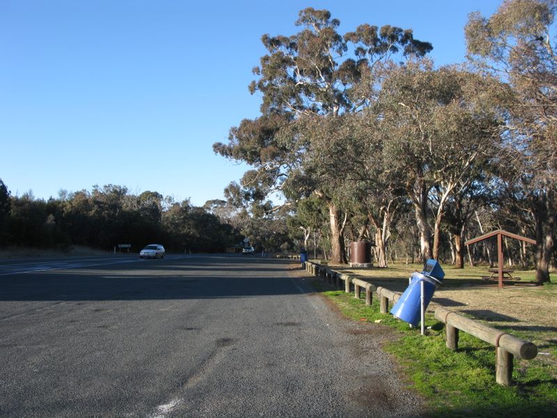 ACT Border Rest Area - Nicholls: Sealed area away from highway with bin and picnic area