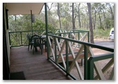 Capricorn Caves Tourist Park - Rockhampton: Cabin deck with views of the bush
