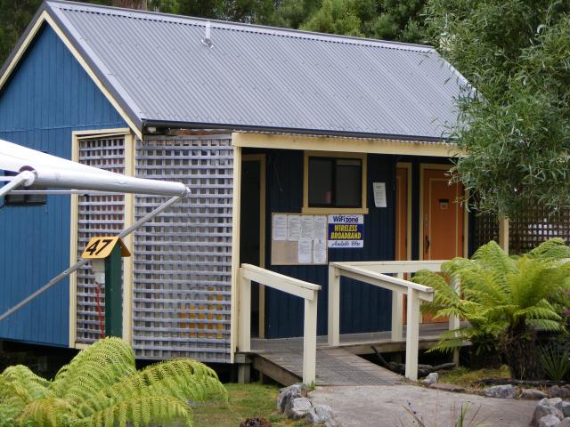 Strahan Holiday Park - Strahan: One of the small amenity blocks dotted around the powered site area.  Unisex - couple of shower and toilet cubicles, and couple of toilet only cubicles - all with seperate entrances
