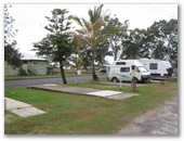 Kingfisher Caravan Park - Tin Can Bay: Powered sites for caravans adjacent to the street.