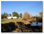Horseshoe Motor Village Caravan Park - Wagga Wagga: Park overview.  The drought has lowered the water level in the lagoon.